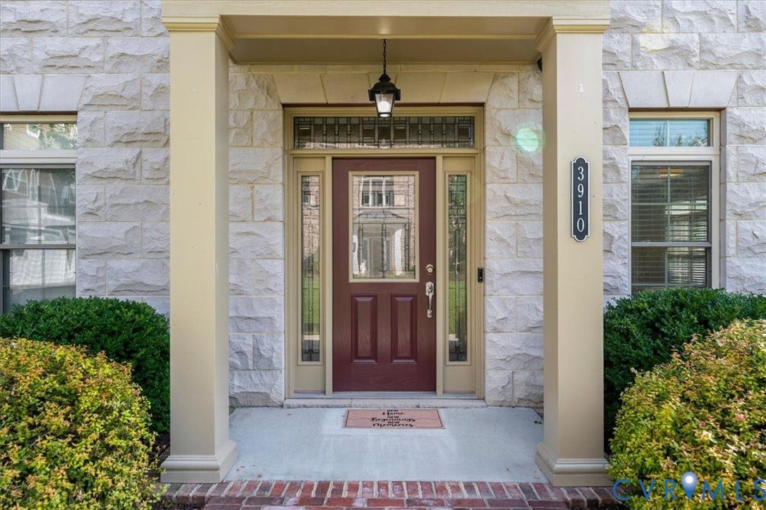 Limestone block exterior with a recessed entryway