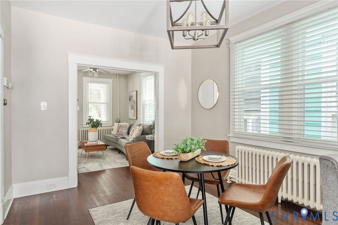 3314 Grayland Avenue, Richmond, VA 23221 Dining area featuring dark wood-finish flooring, a contemporary chandelier, and a large window with white blinds