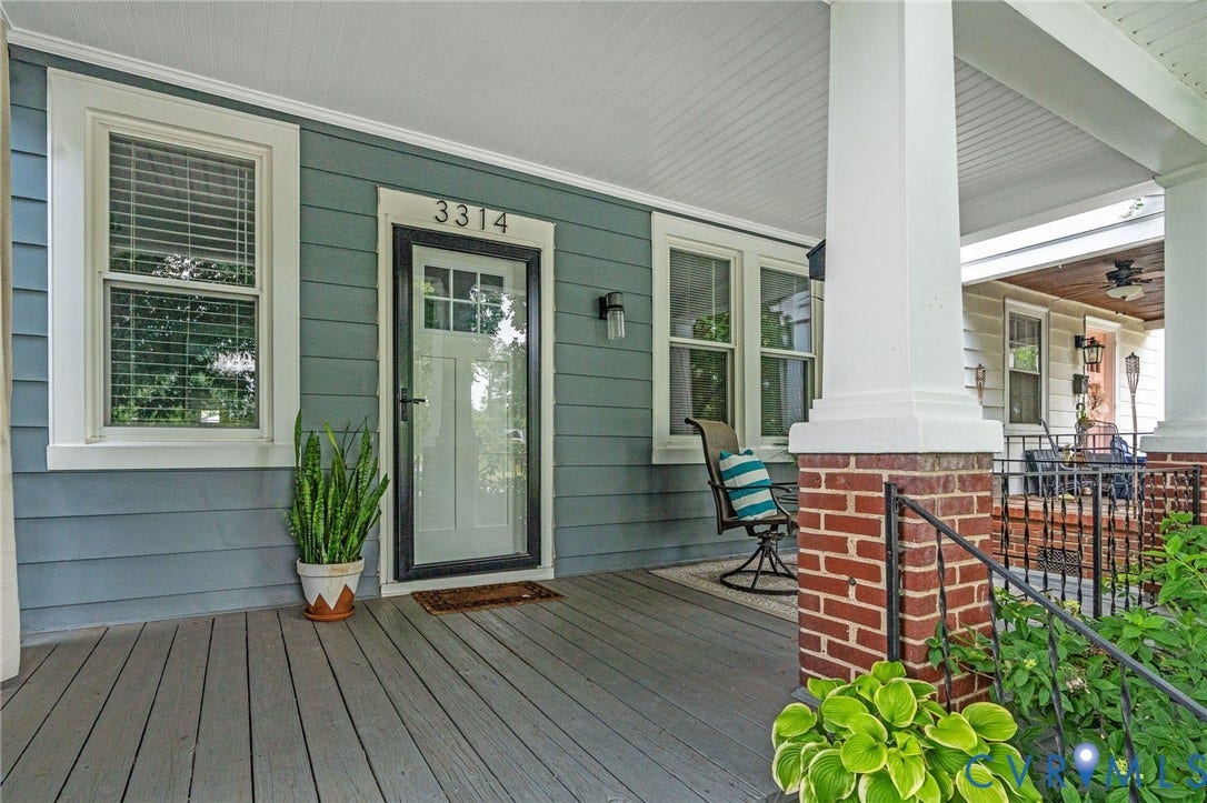 3314 Grayland Avenue, Richmond, VA 23221 Covered front porch featuring a white-framed glass storm door, plank flooring, and a brick base column