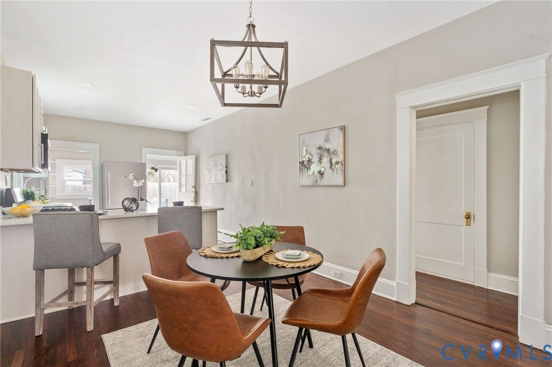 3314 Grayland Avenue, Richmond, VA 23221 Open-concept kitchen and dining area featuring dark wood-finish flooring, light-colored walls, recessed lighting, and a contemporary linear chandelier