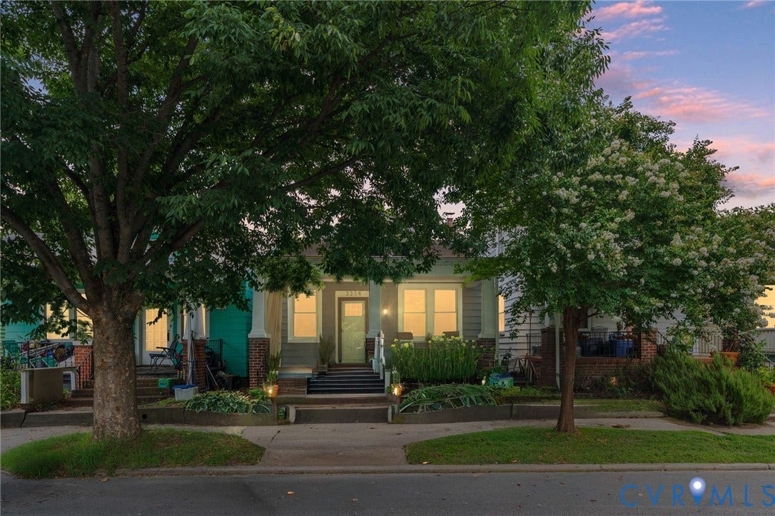 3314 Grayland Avenue, Richmond, VA 23221 Inviting exterior featuring a prominent front porch, mature trees, landscaped planting beds, and exterior lighting fixtures