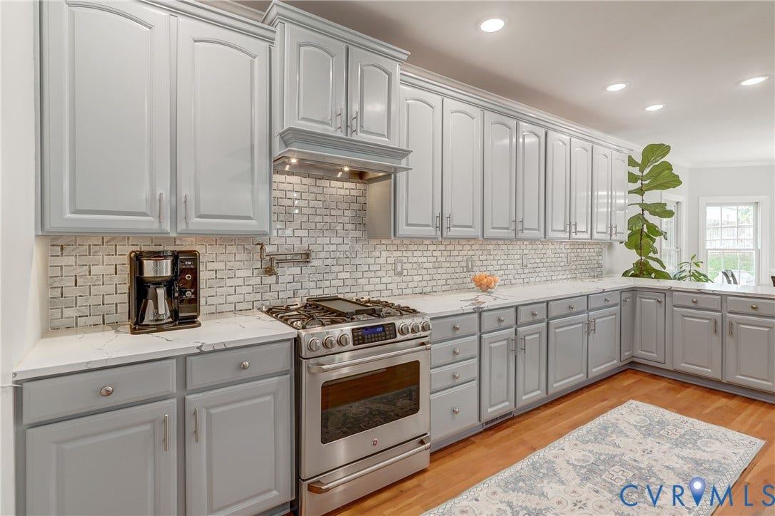332 Rexmoor Terrace, Richmond, VA 23236 Kitchen featuring extensive gray cabinetry with crown molding, stainless steel range with overhead vent, white subway tile backsplash, white countertops, and wood-finish flooring