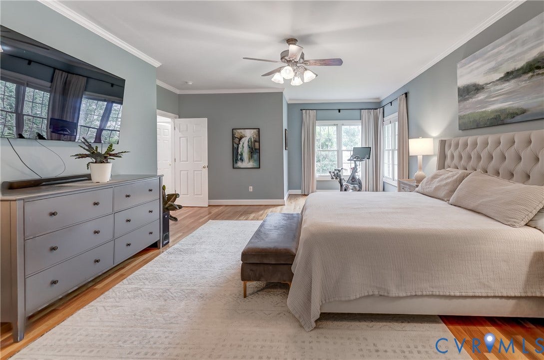 332 Rexmoor Terrace, Richmond, VA 23236 Hardwood flooring throughout featuring crown molding, a ceiling fan with light kit, and multiple windows with natural light