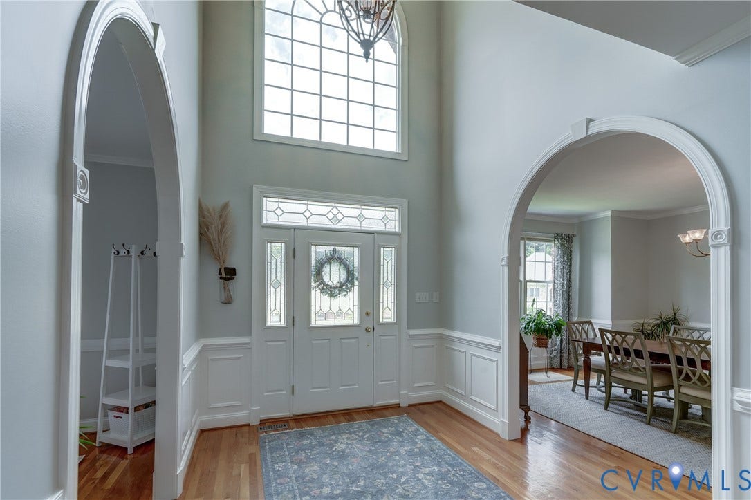 332 Rexmoor Terrace, Richmond, VA 23236 Two-story foyer featuring an arched transom window, leaded glass sidelights, and a wood-finish floor