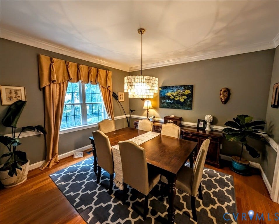 705 Lakewater Drive, Henrico, VA 23229 Dining space featuring wood-finish flooring, a decorative chandelier, and crown molding