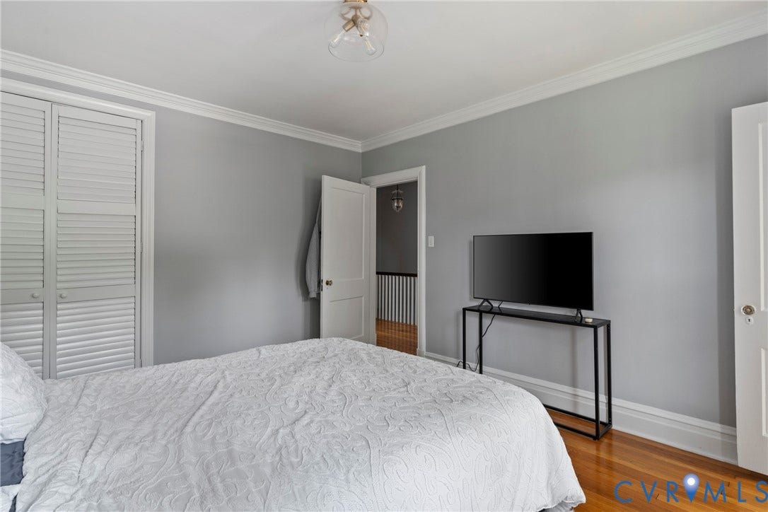 3331 W Grace Street, Monument Avenue, Richmond, VA 23221 Bedroom featuring light gray walls, white crown molding, white baseboards, and wood-finish flooring