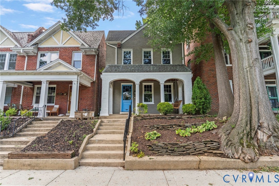 3331 W Grace Street, Monument Avenue, Richmond, VA 23221 Two-story residence featuring a covered front porch with arched openings, a light blue entry door, and a tiered front yard with decorative landscaping
