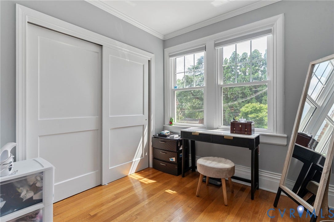 3331 W Grace Street, Monument Avenue, Richmond, VA 23221 Hardwood flooring throughout featuring twin double-hung windows, crown molding, and sliding panel closet doors