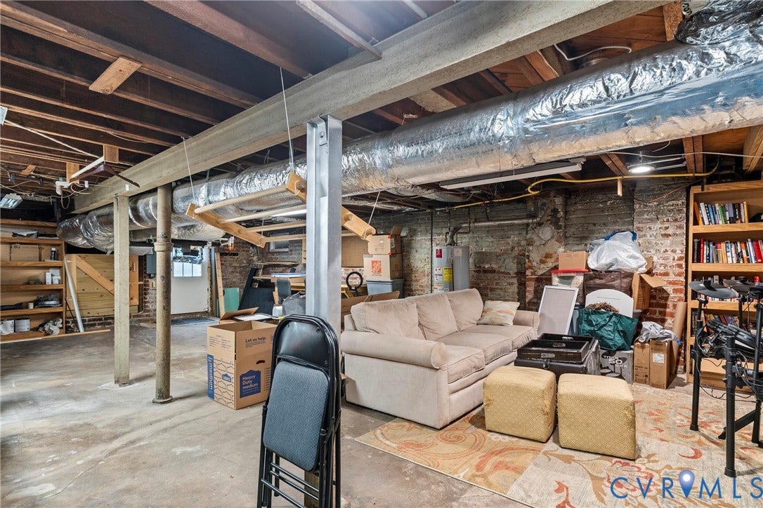 3331 W Grace Street, Monument Avenue, Richmond, VA 23221 Unfinished basement featuring exposed ceiling joists, support beams, and concrete flooring