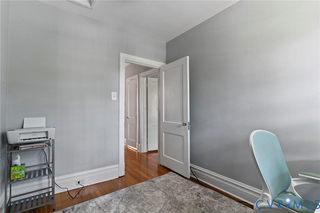 3331 W Grace Street, Monument Avenue, Richmond, VA 23221 Interior room featuring light gray walls, white trim, and wood-finish flooring