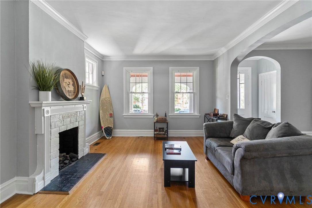 3331 W Grace Street, Monument Avenue, Richmond, VA 23221 Light gray painted walls and rich wood-finish flooring define this living space