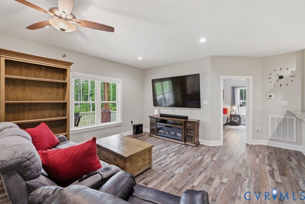 3259 Three Bridge Road, Powhatan, VA 23139 Spacious living area featuring wood-finish flooring, recessed lighting, and a ceiling fan