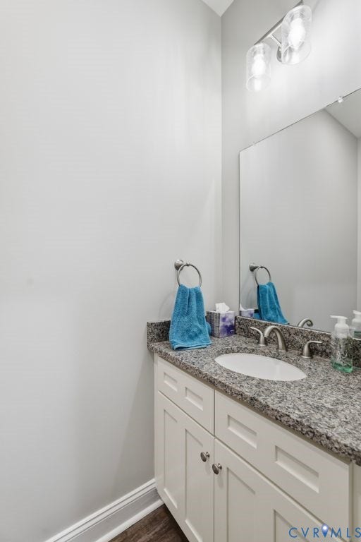 3259 Three Bridge Road, Powhatan, VA 23139 Vanity with white shaker-style cabinetry, a speckled countertop, and an undermount sink