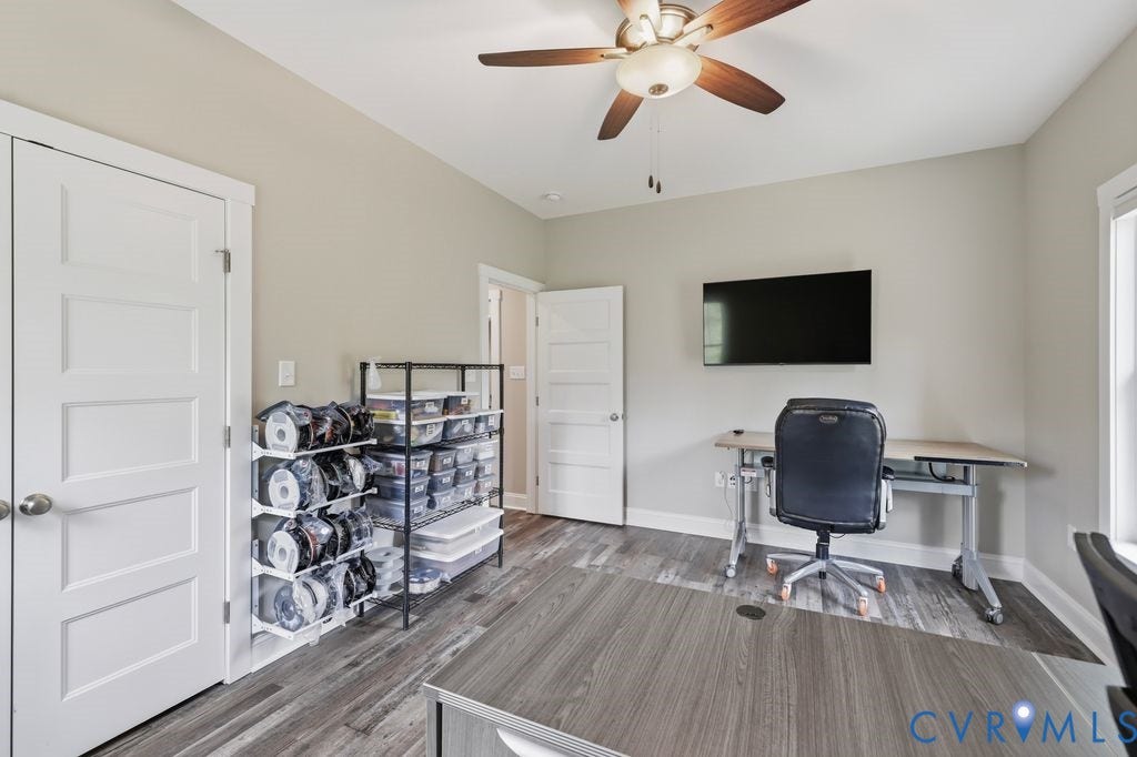 3259 Three Bridge Road, Powhatan, VA 23139 Interior room featuring wood-finish flooring, a ceiling fan with light fixture, and a wall-mounted television