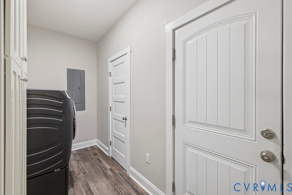 3259 Three Bridge Road, Powhatan, VA 23139 Dedicated utility space featuring wood-finish flooring, white trim, and light gray walls