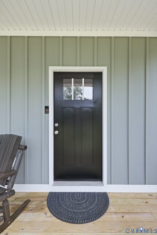3259 Three Bridge Road, Powhatan, VA 23139 Board and batten exterior siding with a covered porch featuring a beadboard ceiling