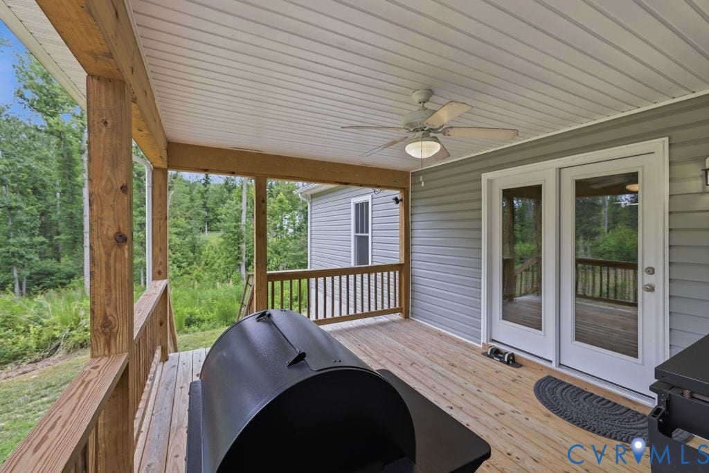 3259 Three Bridge Road, Powhatan, VA 23139 Covered outdoor deck with wood-finish flooring