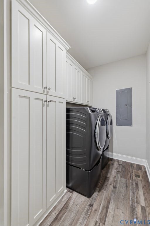 3259 Three Bridge Road, Powhatan, VA 23139 Laundry area featuring extensive white shaker cabinetry, crown molding, and wood-finish flooring