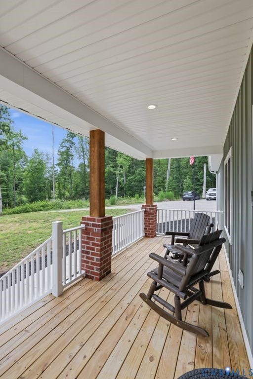 3259 Three Bridge Road, Powhatan, VA 23139 Covered front porch featuring wood plank flooring, white railing, and recessed lighting