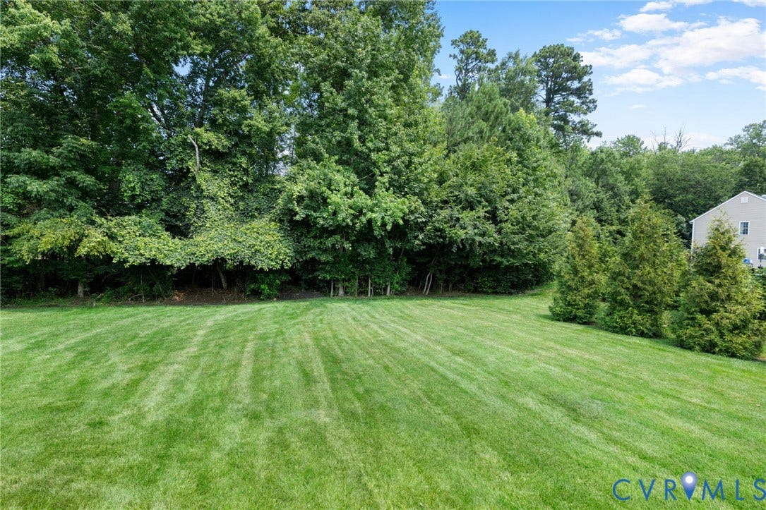 2936 Bayfront Way, Midlothian, VA 23112 Located on a large, cul-de-sac lot with low maintenance brick and vinyl siding, country front porch, 2 car side entry garage, paved driveway sealed in 2025, front/rear/side high-end irrigation system and Trex deck that overlooks the spacious rear yard!