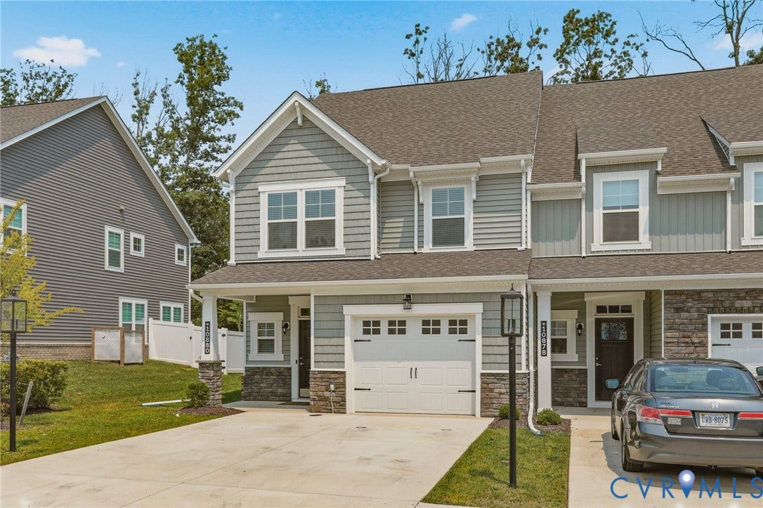 10880 Farmstead Mill Lane, Glen Allen, VA 23059 Modern townhome with a two-car driveway and an attached one-car garage