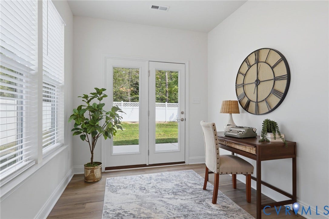 10880 Farmstead Mill Lane, Glen Allen, VA 23059 Room featuring wood-finish flooring, white walls, and bright natural light from multiple windows