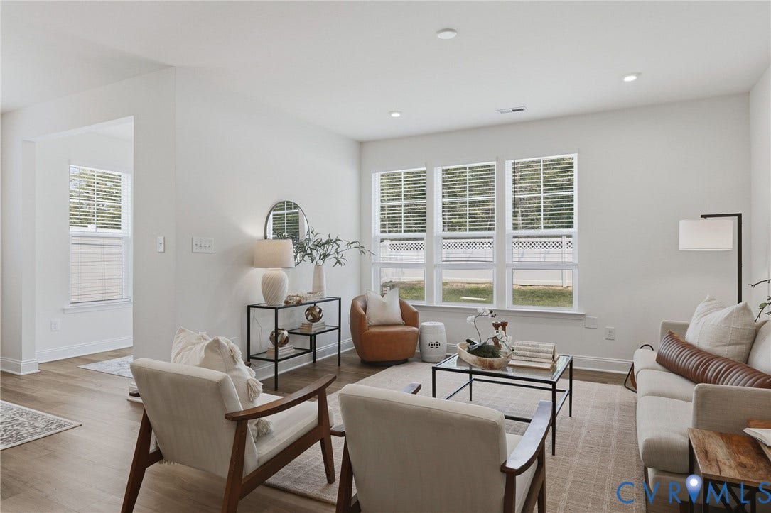 10880 Farmstead Mill Lane, Glen Allen, VA 23059 Bright living space featuring multiple windows with blinds, recessed lighting, wood-finish flooring, and white baseboards