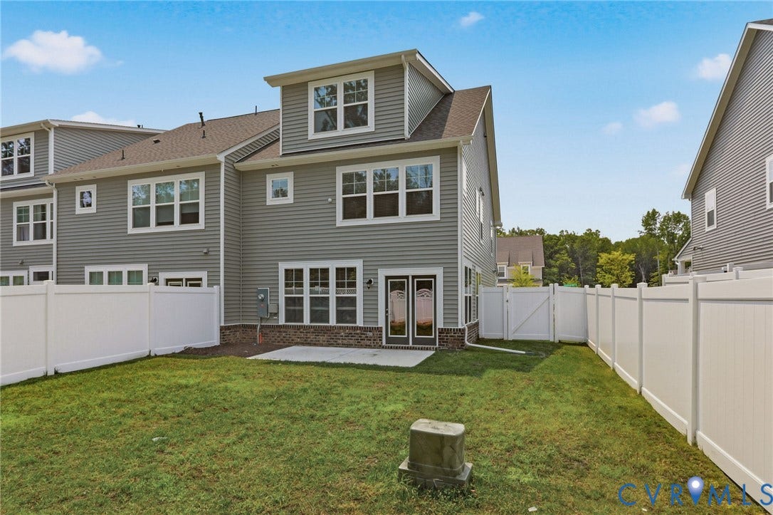10880 Farmstead Mill Lane, Glen Allen, VA 23059 Expansive grassy yard featuring a private white vinyl fence