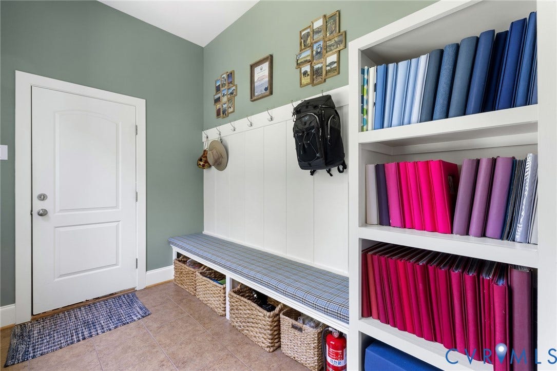 15936 Alsdell Road, Hallsley, Midlothian, VA 23112 Entryway featuring neutral tile flooring, a white paneled door, and a built-in bench with integrated storage cubbies