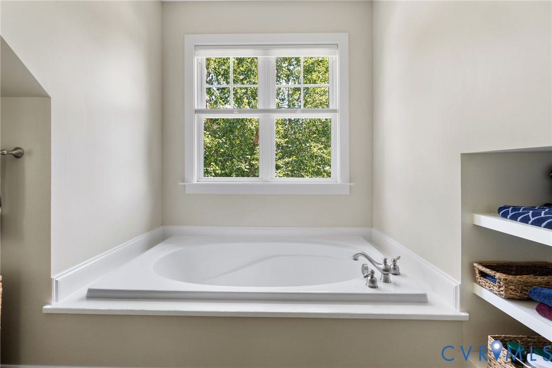 15936 Alsdell Road, Hallsley, Midlothian, VA 23112 Built-in soaking tub with brushed nickel fixtures and surrounding white countertop