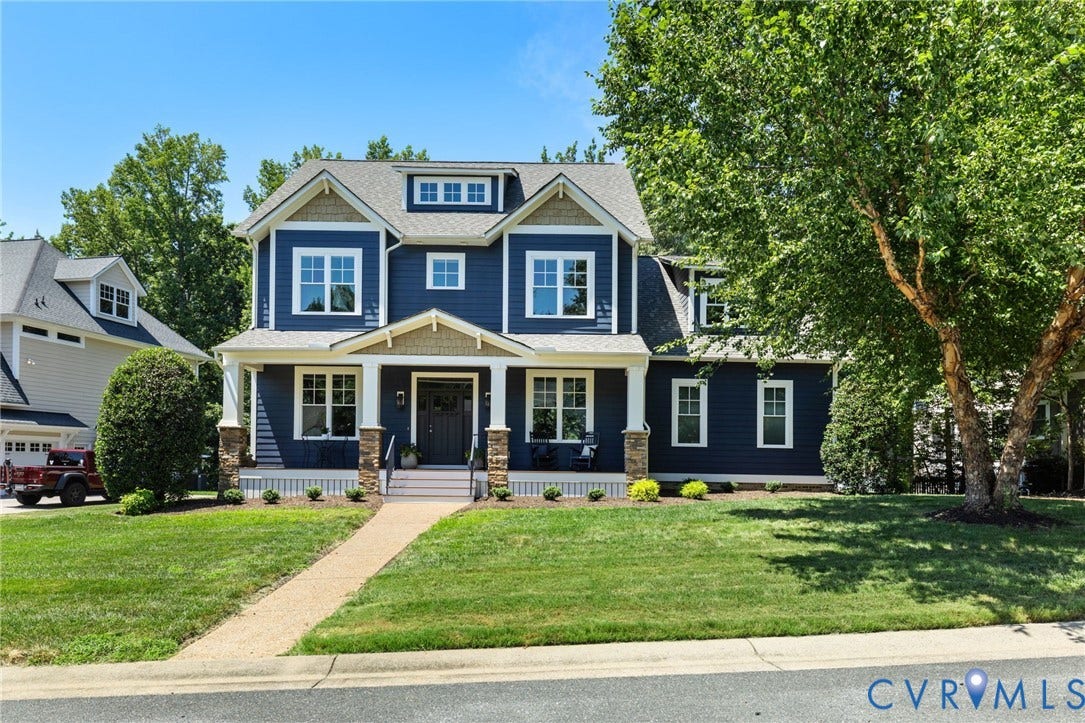 15936 Alsdell Road, Hallsley, Midlothian, VA 23112 Navy blue siding exterior with white trim and a covered front porch featuring stone columns