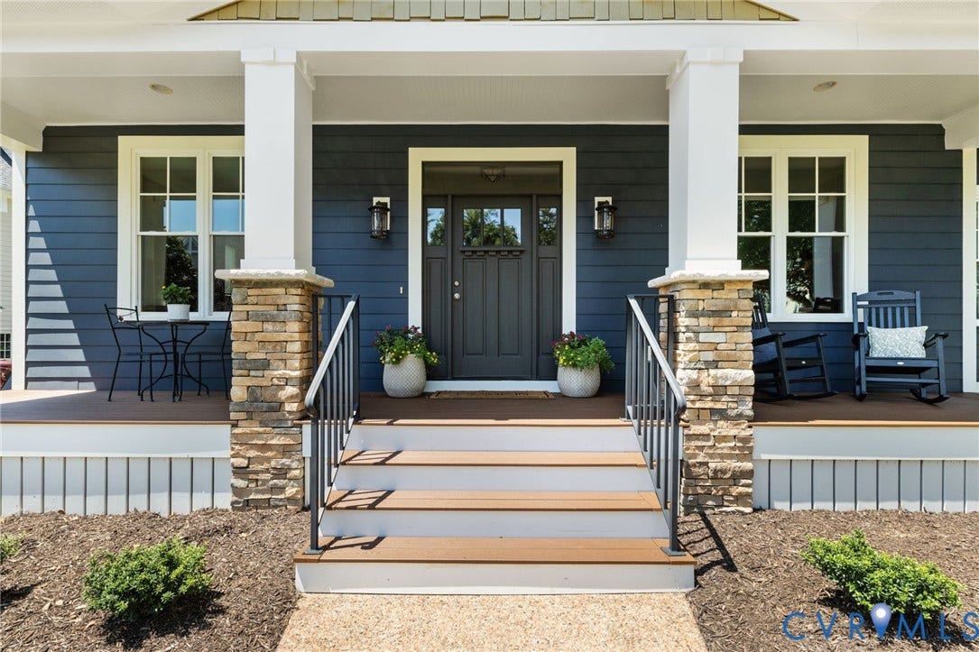 15936 Alsdell Road, Hallsley, Midlothian, VA 23112 Inviting covered front porch with stone-wrapped columns, dark gray siding, and a paneled front door