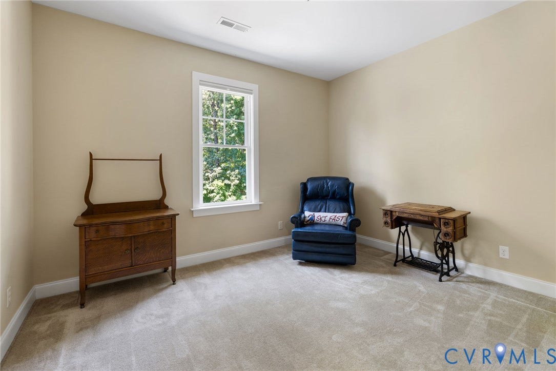 15936 Alsdell Road, Hallsley, Midlothian, VA 23112 Bright room featuring neutral wall tones, white trim, a double-hung window, and carpet flooring