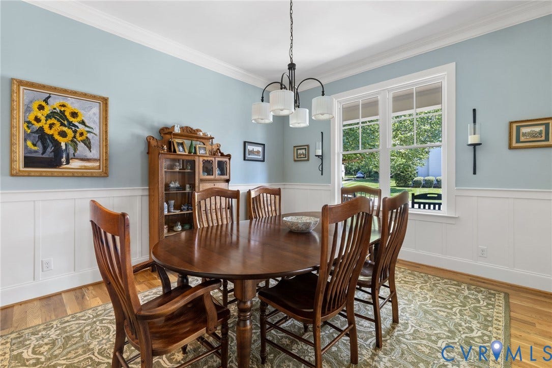 15936 Alsdell Road, Hallsley, Midlothian, VA 23112 Dining area featuring light blue walls with white wainscoting, crown molding, and wood-finish flooring