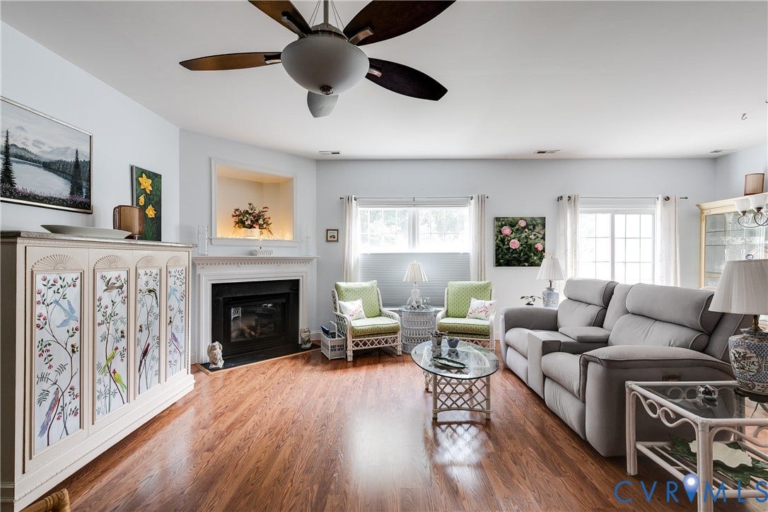 130 Carriage Point Lane, Henrico, VA 23059 Family Room Featuring Vinyl Wood Flooring, Gas Fireplace, and Ceiling Fan.
