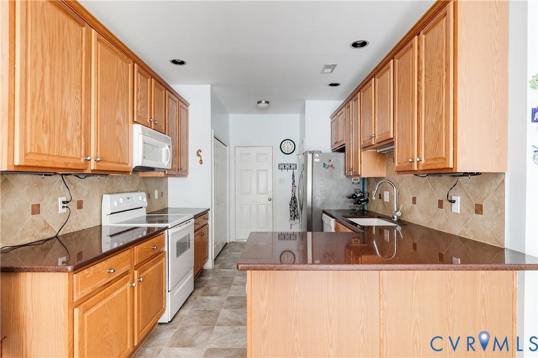 130 Carriage Point Lane, Henrico, VA 23059 Kitchen Featuring Custom Tile Backsplash.