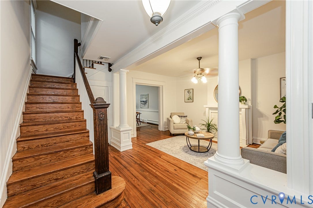 Hardwood flooring extends throughout the main living spaces