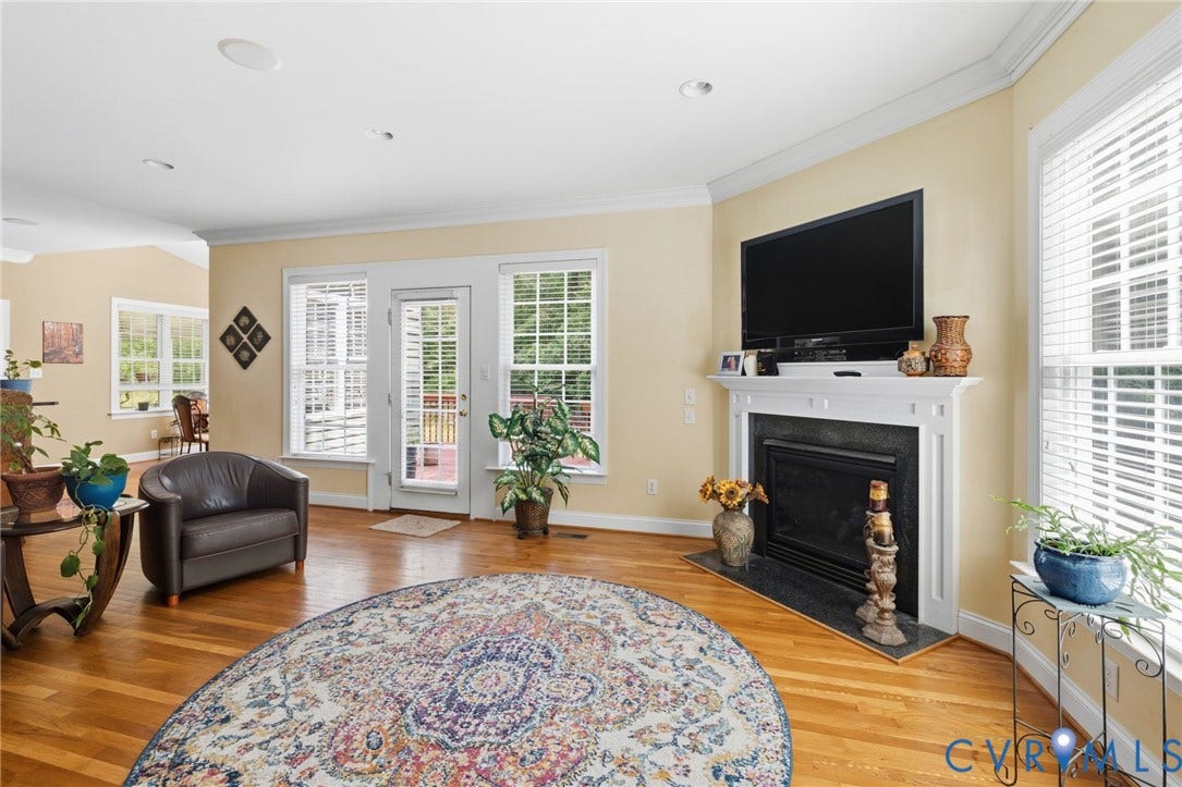 3337 Scarlet Oak Drive, Powhatan, VA 23139 Open-concept living space featuring wood floors