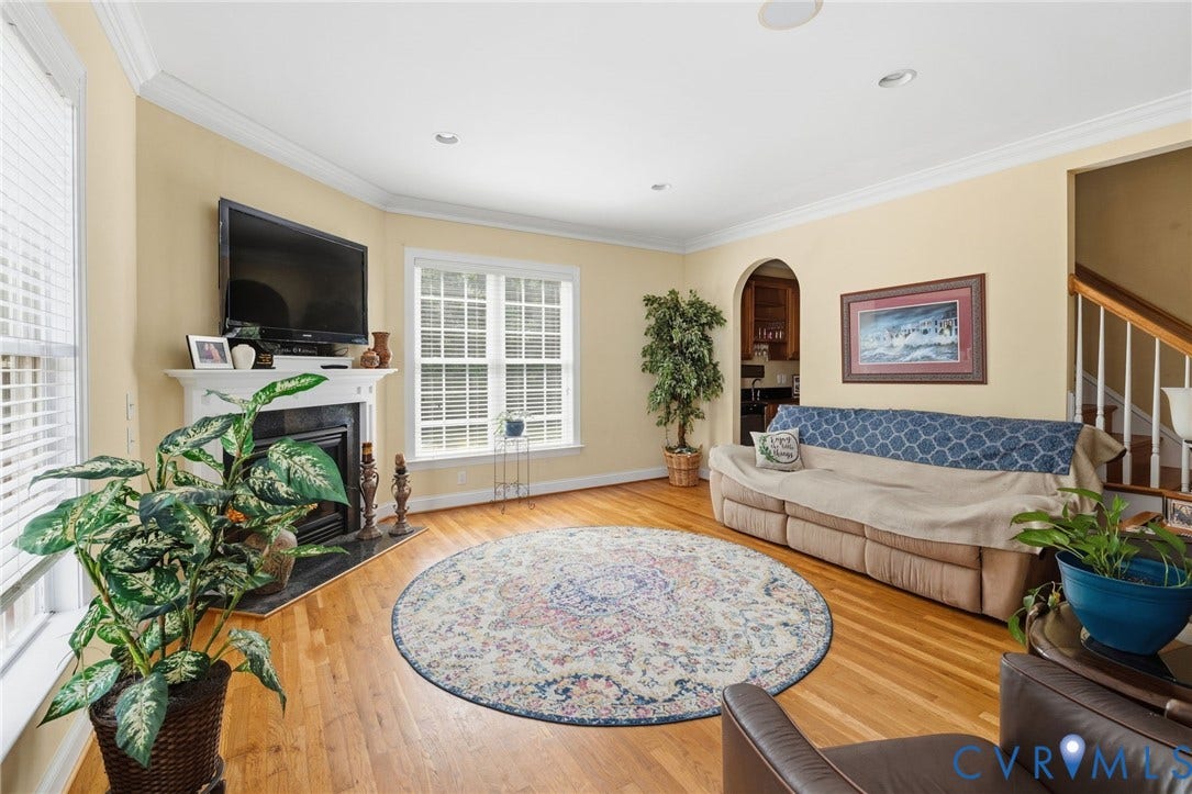 3337 Scarlet Oak Drive, Powhatan, VA 23139 Living room featuring hardwood flooring and a fireplace