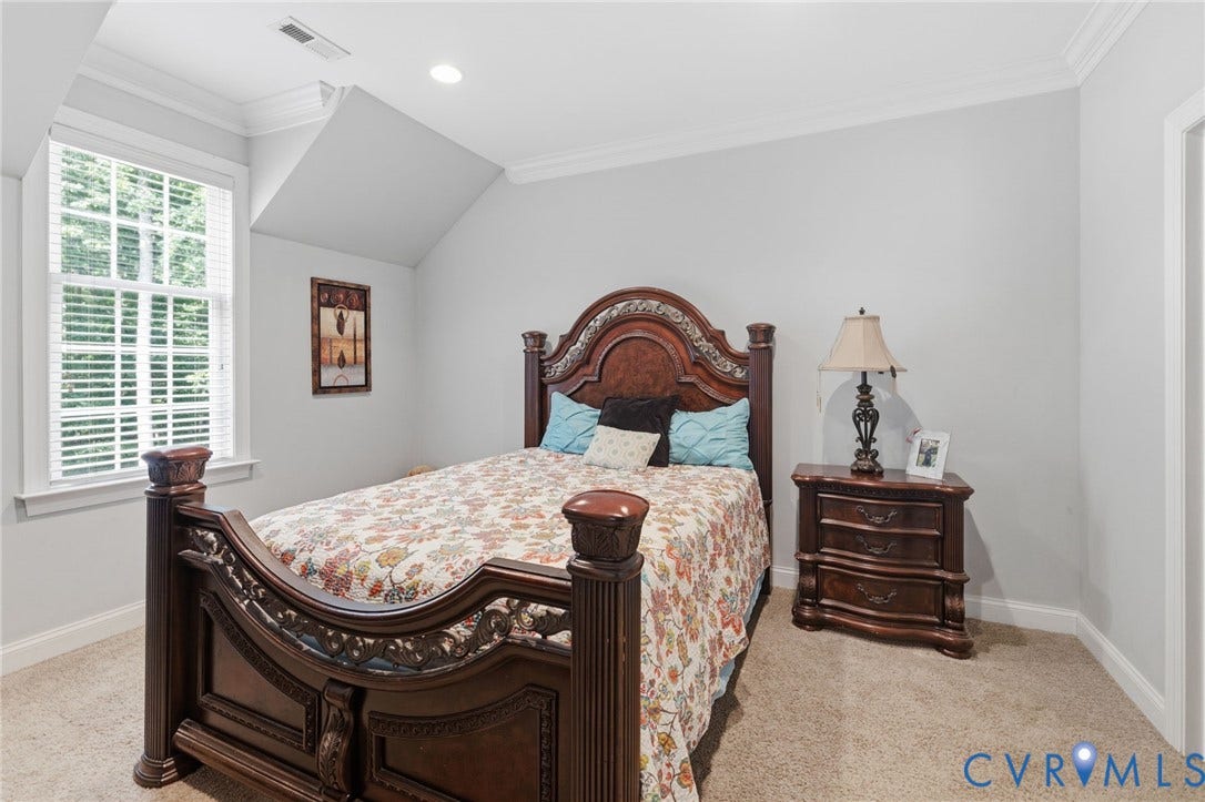 3337 Scarlet Oak Drive, Powhatan, VA 23139 Carpeted room featuring a tall window with blinds, recessed lighting, crown molding, and an angled ceiling