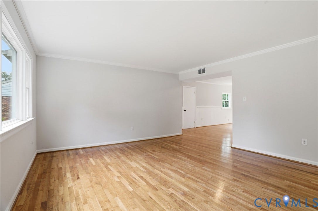 5301 Dalglish Road, Henrico, VA 23223 Hardwood flooring throughout a room with light gray walls and white trim