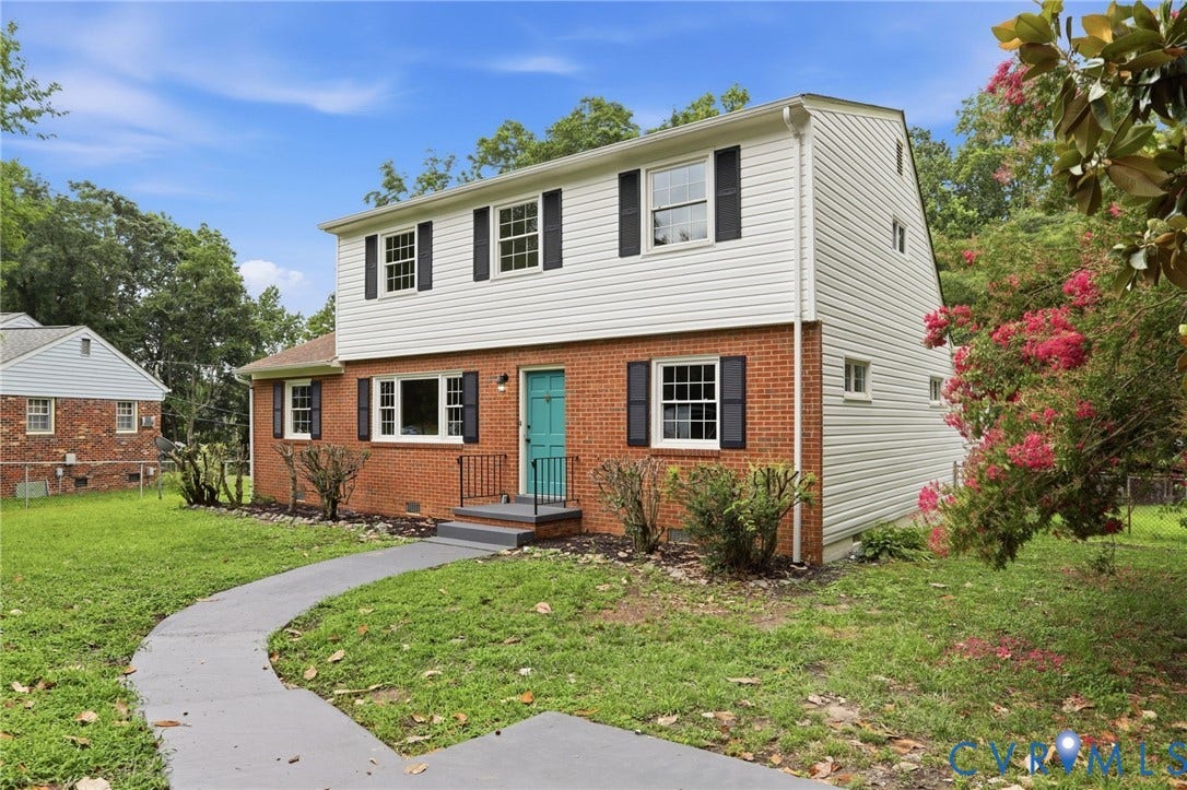 5301 Dalglish Road, Henrico, VA 23223 Two-story residence featuring a brick first level with white siding on the second level and a teal entrance door