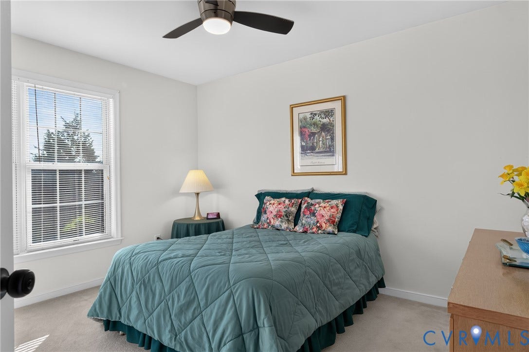 10817 Correnty Drive, Glen Allen, VA 23059 Light-filled bedroom featuring a window with white blinds, neutral carpeting, a ceiling fan, and crisp white walls