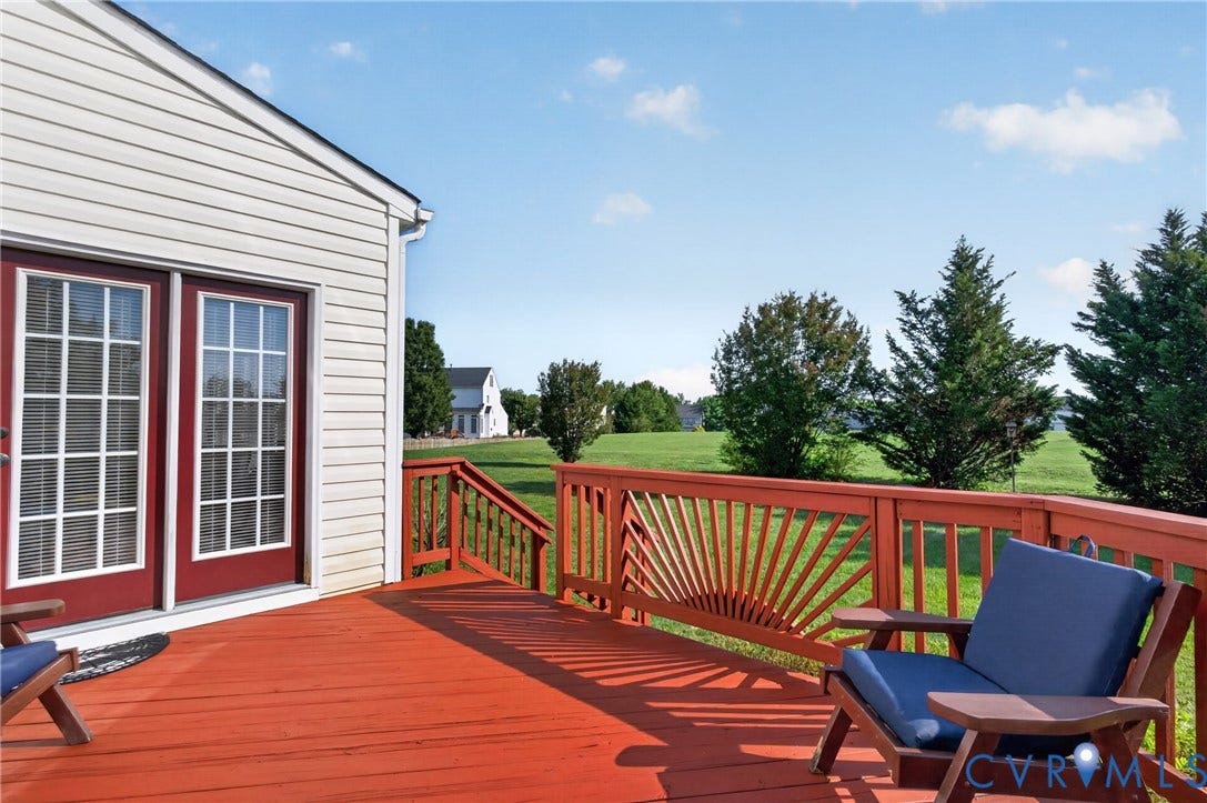 10817 Correnty Drive, Glen Allen, VA 23059 Spacious wood deck featuring a vibrant red finish and decorative railing