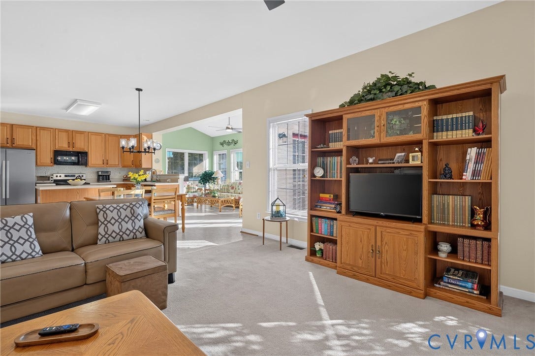 10817 Correnty Drive, Glen Allen, VA 23059 Open concept living area featuring light-toned walls and plush carpeting