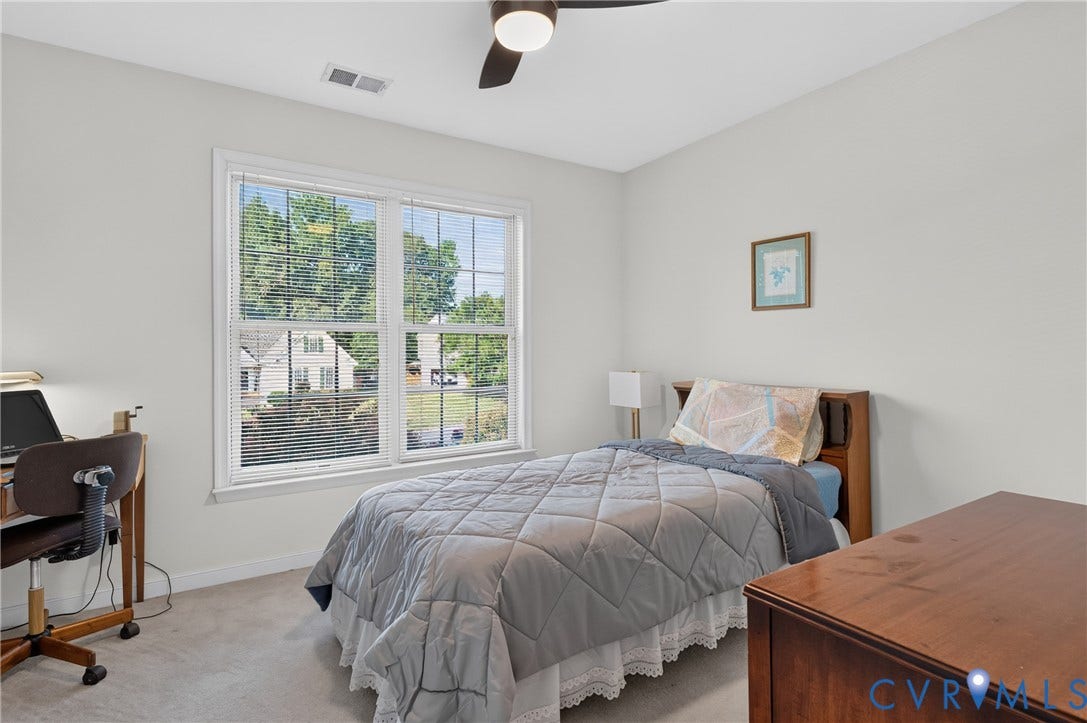 10817 Correnty Drive, Glen Allen, VA 23059 Room featuring a large window with white blinds, light neutral wall paint, and a ceiling fan with integrated lighting