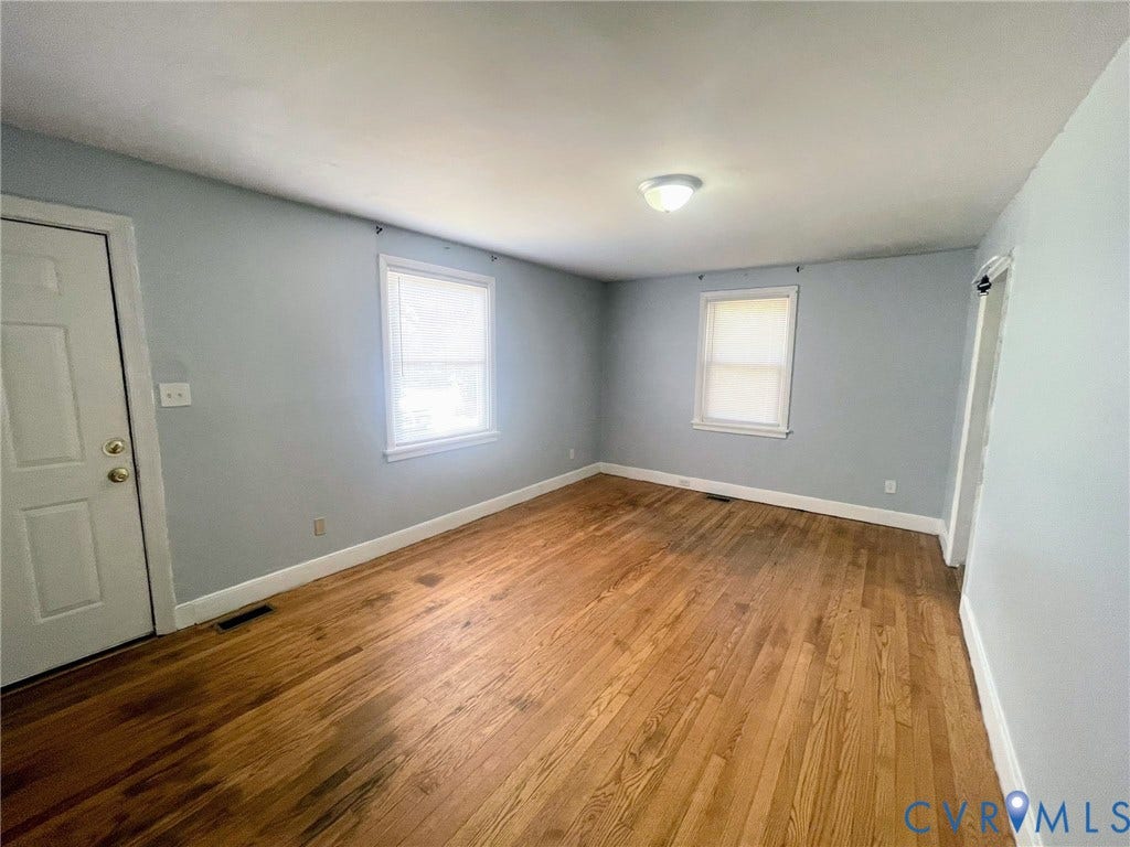 1417 Bowen Street, Oak Grove, Richmond, VA 23224 Living room: wood floors, overhead lighting, window facing front of house