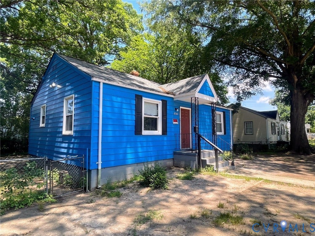 1417 Bowen Street, Oak Grove, Richmond, VA 23224 Vibrant blue siding exterior with white trim accents and black shutters