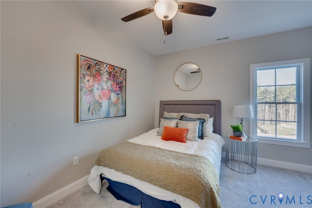 6408 Sanford Springs Cove, Midlothian, VA 23112 Bedroom featuring light gray wall paint, a ceiling fan with integrated lighting, and carpet flooring