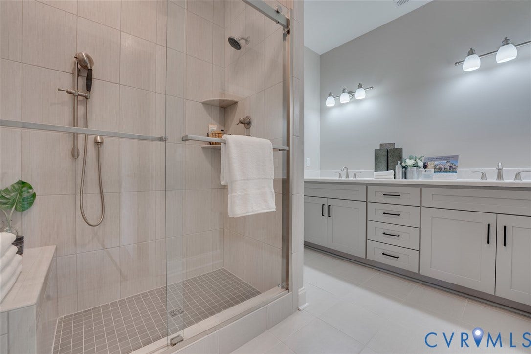 6408 Sanford Springs Cove, Midlothian, VA 23112 Walk-in shower with clear glass enclosure and tile surround
